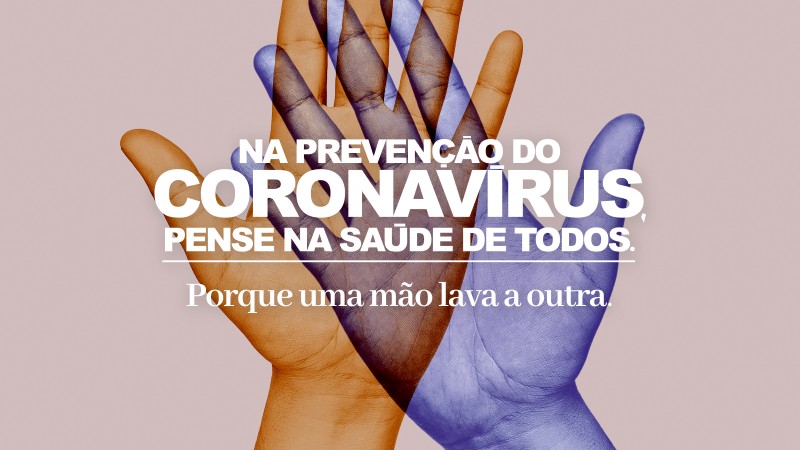 A imagem mostra duas mãos estilizadas nas cores laranja e roxa e a mensagem: "Na prevenção do Coronavírus, pense na saúde de todos. Porque uma mão lava a outra".
