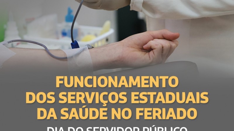 A imagem mostra o braço de uma pessoa recebendo doação de sangue. Embaixo, tem o seguinte texto: "Funcionamento dos Serviços Estaduais da Saúde no Feriado- Dia do Servidor Público". 