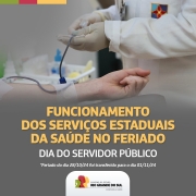 A imagem mostra o braço de uma pessoa recebendo doação de sangue. Embaixo, tem o seguinte texto: "Funcionamento dos Serviços Estaduais da Saúde no Feriado- Dia do Servidor Público". 