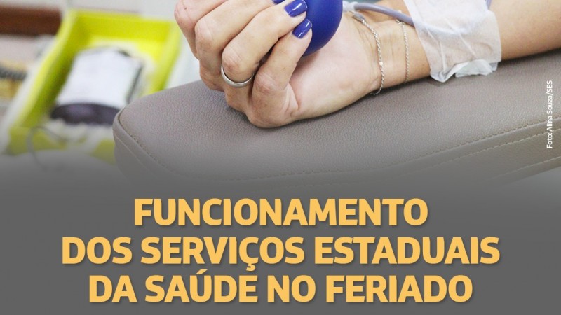 A imagem mostra o braço de uma mulher segurando uma bolinha no momento da doação de sangue. Embaixo, está escrito "Funcionamento dos Serviços Estaduais da Saúde no Feriado de Ano Novo".  